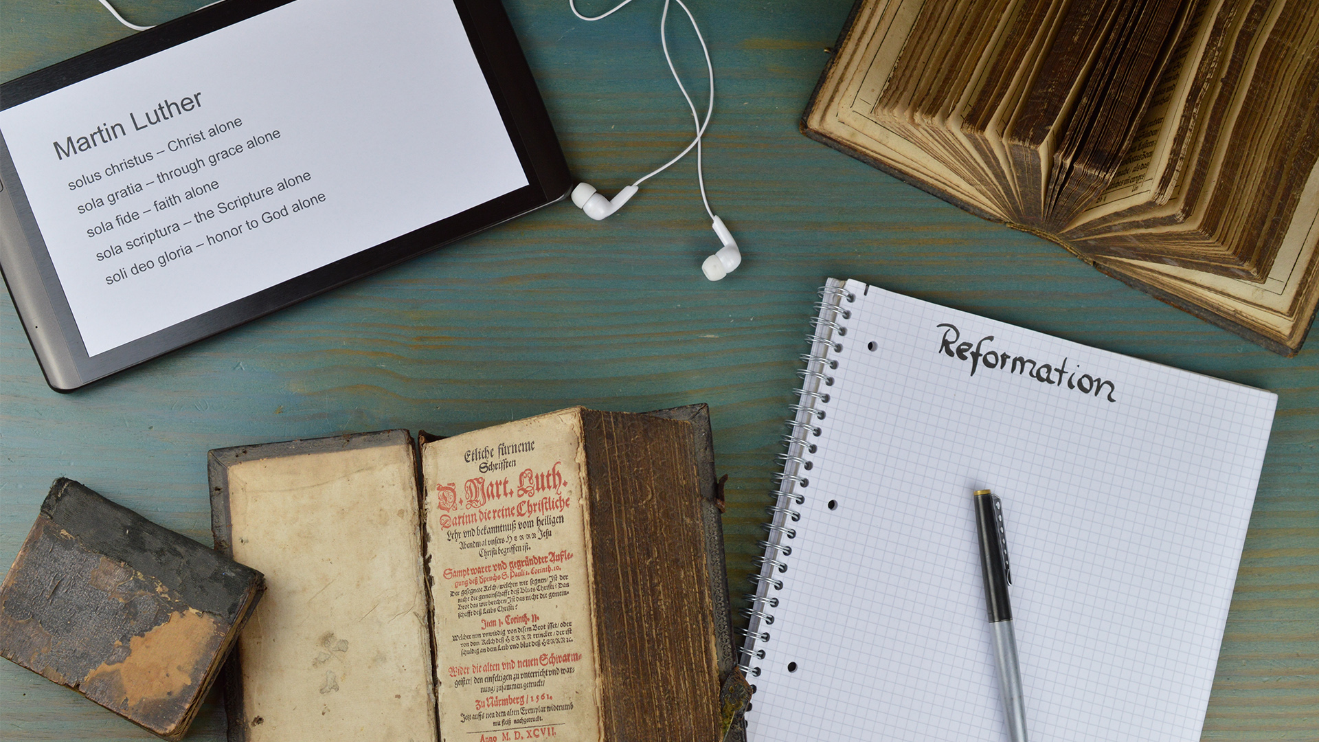 image of notebook and tablet with notes about Martin Luther